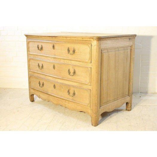 Early 19th century French oak commode with panelled ends