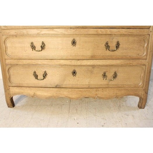 Early 19th century French oak commode with panelled ends