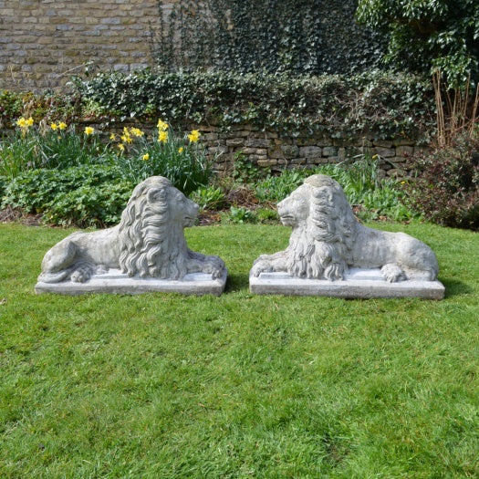 Pair of Recumbent Composition Lions