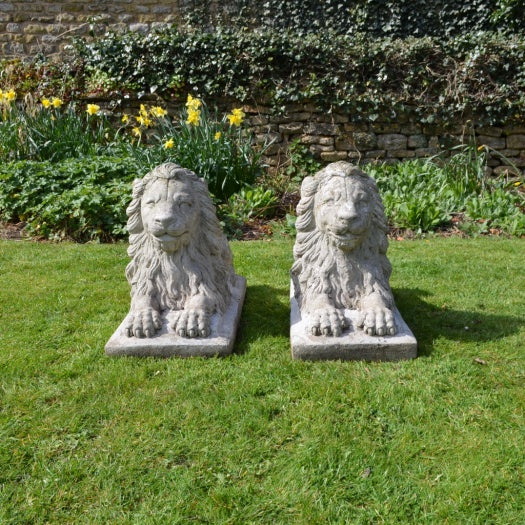 Pair of Recumbent Composition Lions